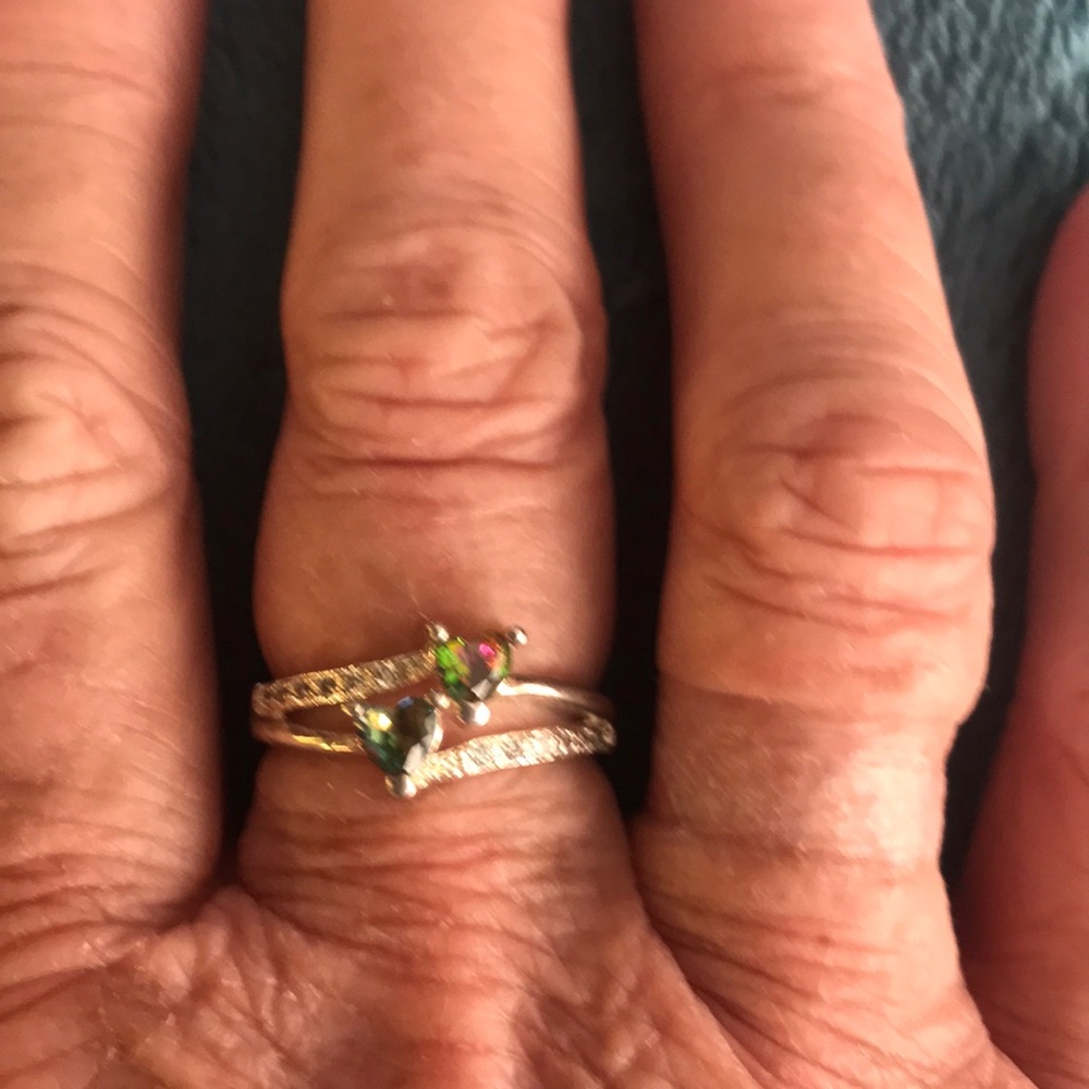 New silver ring with topaz colored stones
